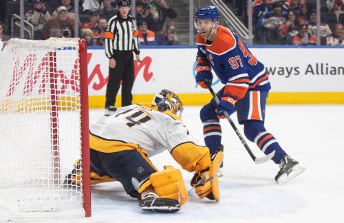 Nashville Predators goalie Juuse Saros (74) is scored on by Edmonton Oilers' Connor McDavid (97) during second period NHL action, in Edmonton on Tuesday, Jan. 6, 2026. THE CANADIAN PRESS/Jason Franson