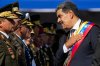 FILE - Venezuela's President Nicolas Maduro places his hand over his hear while talking to high-ranking officers during a military ceremony on his inauguration day for a third term, in Caracas, Venezuela, Jan. 10, 2025. (AP Photo/Ariana Cubillos, File)