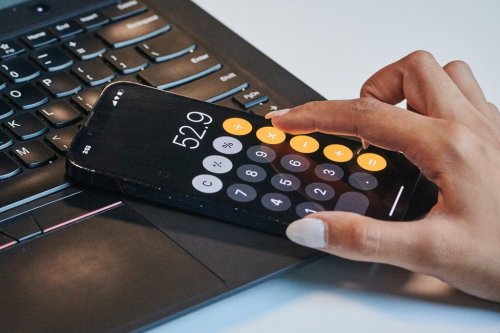 A person uses the calculator app on their phone in a photo illustration made in Toronto, on Monday, Sept. 22, 2025. THE CANADIAN PRESS/Sammy Kogan