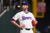 FILE - Texas Rangers pitcher Chris Martin stands on the mound just before leaving a baseball game against the Colorado Rockies, May 13, 2025, in Arlington, Texas. (AP Photo/LM Otero, File)
