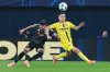 Villarreal's Alberto Moleiro, right, challenges for the ball with Copenhagen's Jordan Larsson during the Champions League opening phase soccer match between Villarreal and Copenhagen in Villarreal, Spain, Wednesday, Dec. 10, 2025. (AP Photo/Alberto Saiz)