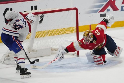 Montreal Canadiens centre Nick Suzuki (14) scores the game winning goal against Florida Panthers goaltender Daniil Tarasov (40) during overtime in an NHL hockey game, Tuesday, Dec. 30, 2025, in Sunrise, Fla. (AP Photo/Lynne Sladky)