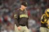 FILE - San Diego Padres pitching coach Ruben Niebla looks on during a baseball game against the Washington Nationals, July 19, 2025, in Washington. (AP Photo/Nick Wass, File)
