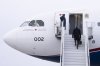 Prime Minister Mark Carney boards a government plane in Ottawa on Monday, Jan. 5, 2026. THE CANADIAN PRESS/Christinne Muschi
