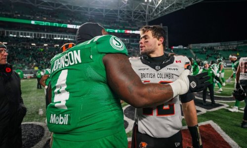B.C. Lions quarterback Nathan Rourke (right) speaks with Saskatchewan Roughriders defensive lineman Micah Johnson (4) after the CFL West Division final in Regina, on Saturday, November 8, 2025. THE CANADIAN PRESS/Heywood Yu