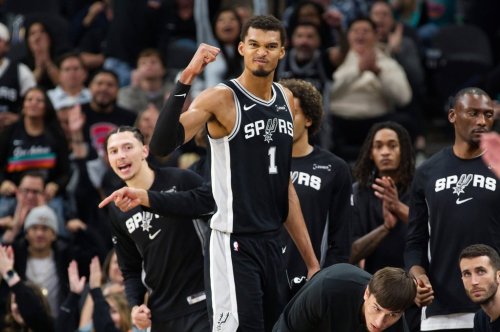 San Antonio Spurs center Victor Wembanyama (1) celebrates a basket during the second half of an NBA basketball game against the New York Knicks, Wednesday, Dec. 31, 2025, in San Antonio. (AP Photo/Darren Abate)