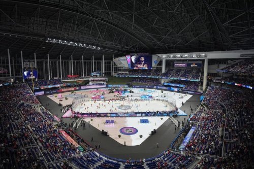 Players warm up before the NHL Winter Classic outdoor hockey game between the Florida Panthers and the New York Rangers, Friday, Jan. 2, 2026, in Miami. (AP Photo/Rebecca Blackwell)