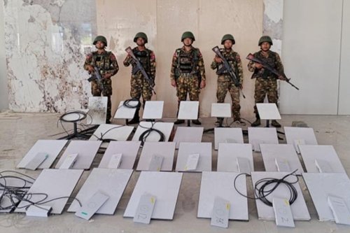 FILE - In this image provided by the Myanmar military on Oct. 19, 2025, soldiers stand next to Starlink satellite internet devices as they seize KK Park online scam center in Myawaddy township, Karen State, Myanmar. (The Myanmar Military True News Information Team via AP, File)