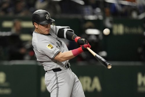 Yomiuri Giants third baseman Kazuma Okamoto flies out in the second inning of an exhibition game against the Los Angeles Dodgers in Tokyo, Japan on March 15, 2025. (AP Photo/Hiro Komae)