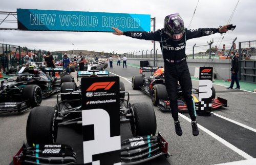 FILE - Mercedes driver Lewis Hamilton of Britain jumps out of his car after his record breaking 92nd win at the Formula One Portuguese Grand Prix at the Algarve International Circuit in Portimao, Portugal, Sunday, Oct. 25, 2020. (Jorge Guerrero, Pool via AP, File)