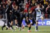 Washington players celebrates after defeating North Carolina State to win the NCAA College Cup National Championship soccer final in Cary, N.C., Monday, Dec. 15, 2025. (AP Photo/Ben McKeown)