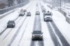 Traffic creeps along snow-covered roads in Calgary on Monday, Nov. 7, 2022. THE CANADIAN PRESS/Jeff McIntosh