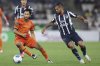 David Choinière of Forge, left, carries the ball challenged by Monterrey's Jesus Corona during a CONCACAF Champions Cup soccer match at the BBVA stadium in Monterrey, Mexico, Tuesday, Feb. 11, 2025. (AP Photo/Jorge Mendoza)