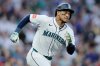 FILE - Seattle Mariners' Jorge Polanco runs on his two-RBI double against the Los Angeles Angels during the first inning of a baseball game Saturday, Sept. 13, 2025, in Seattle. (AP Photo/John Froschauer, File)