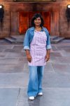 Contestant Priya Winsor poses on the set of Food Network's 