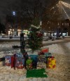 Food allegedly taken from a Montreal grocery store by a group calling themselves Robins des Ruelles — Robins of the alleys — is seen placed a public square in the Mercier-Hochelaga-Maisonneuve borough at the foot of a Christmas tree. THE CANADIAN PRESS/Handout — Les Soulèvements du fleuve, on behalf of Robin des Ruelles (Mandatory Credit)