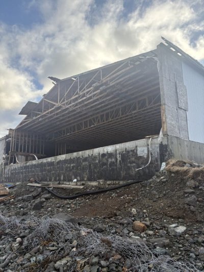 High winds tore the wall of this abandoned fish sauce plant in St. Mary's, N.L., shown on Jan, 17, 2026, leaving more than 100 oozing vats of fermented fish sauce exposed to the nearby ocean. THE CANADIAN PRESS/Handout - Steve Ryan (Mandatory Credit)