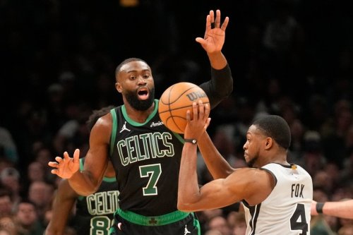 Boston Celtics guard Jaylen Brown (7) guards San Antonio Spurs guard De'aaron Fox (4) during the first half of an NBA basketball game, Saturday, Jan. 10, 2026, in Boston. (AP Photo/Robert F. Bukaty)