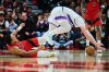 Toronto Raptors' Scottie Barnes (4) yells out after Utah Jazz's Jusuf Nurkic (30) stepped on his foot during second half NBA basketball action in Toronto, on Sunday, Feb. 1, 2026. THE CANADIAN PRESS/Sammy Kogan