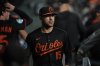 FILE - Baltimore Orioles left fielder Dylan Carlson walks through the dugout before a baseball game against the Houston Astros in Houston, Aug. 15, 2025. (AP Photo/Ashley Landis, File)