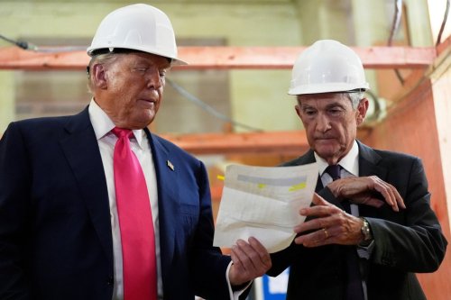 FILE - Federal Reserve Chairman Jerome Powell, right, and President Donald Trump look over a document of cost figures during a visit to the Federal Reserve, Thursday, July 24, 2025, in Washington. (AP Photo/Julia Demaree Nikhinson, File)
