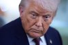 President Donald Trump speaks with reporters aboard Air Force One after leaving the World Economic Forum in Davos for Washington, Thursday, Jan. 22, 2026. (AP Photo/Evan Vucci)