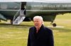 President Donald Trump shouts a comment as he walks to Marine One for departure from the South Lawn of the White House on Friday, Jan. 16, 2026, in Washington. (AP Photo/Alex Brandon)