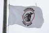 A tattered Kashechewan First Nation flag flies outside St. Paul's Anglician church on the Kashechewan native reserve in northern Ontario Sunday, Oct. 30, 2005. THE CANADIAN PRESS/Jonathan Hayward