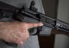 A restricted gun licence holder holds a AR-15 at his home in Langley, B.C., Friday, May 1, 2020. THE CANADIAN PRESS/Jonathan Hayward