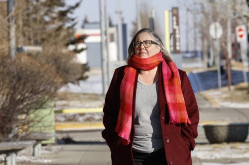 Colleen Whitley walks to a hospital to visit her mother in Calgary, Friday, Jan. 23, 2026. THE CANADIAN PRESS/Larry MacDougal