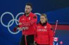 Canada's Brett Gallant, left, and Jocelyn Peterman look on during the mixed doubles round robin phase of the curling competition against the Czech Republic at the 2026 Winter Olympics, in Cortina d'Ampezzo, Italy, Wednesday, Feb. 4, 2026. (AP Photo/Misper Apawu)