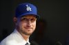 Outfielder Kyle Tucker looks on during a news conference after joining the Los Angeles Dodgers baseball team, Wednesday, Jan. 21, 2026, in Los Angeles. (AP Photo/Damian Dovarganes)