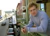 FILE - Robert Redford poses on a balcony along Main Street decorated with his Sundance Film Festival banners on Jan. 17, 2003, in Park City, Utah. (AP Photo/Douglas C. Pizac, File)