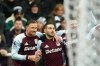 Aston Villa's Emi Buendia, center, celebrates with teammates after scoring their side's first goal during their English Premier League soccer match against Newcastle United in Newcastle upon Tyne, England, Sunday, Jan. 25, 2026. (Owen Humphreys/PA via AP)