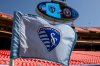 FILE - A Sporting Kansas City flag flies prior to an MLS soccer match between Sporting Kansas City and Inter Miami, April 13, 2024, in Kansas City, Mo. (AP Photo/Nick Tre. Smith, File)