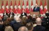 Speaker of the Senate Raymonde Gagne, Prime Minister Mark Carney and Speaker of the House of Commons Francis Scarpaleggia laugh as former prime minister Stephen Harper delivers his speech during a ceremony marking the unveiling of his official portrait in Ottawa on Tuesday, Feb. 3, 2026 in Ottawa. THE CANADIAN PRESS/Adrian Wyld