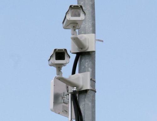 Surveillance cameras monitor a road in Abbotsford, B.C., Friday, April 3, 2009. THE CANADIAN PRESS/Darryl Dyck