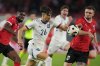 FILE - Serbia's Veljko Birmančević, centre, controls the ball ahead Austria's Stefan Posch, right, during an international friendly soccer match between Austria and Serbia at the Ernst Happel Stadion in Vienna, Austria, Tuesday, June 4, 2024. (AP Photo/Matthias Schrader, File)
