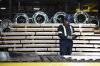Workers inspect sheets of stainless steel after being pressed from coils, at Magna Stainless and Aluminum in Montreal on Thursday, Sept. 18, 2025. THE CANADIAN PRESS/Christopher Katsarov