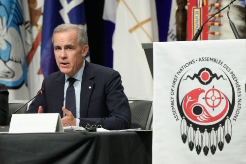 Prime Minister Mark Carney responds to questions from the floor at the Assembly of First Nations Special Chiefs Assembly in Ottawa on Tuesday, Dec. 2, 2025. THE CANADIAN PRESS/Adrian Wyld
