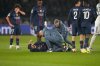 PSG's Khvicha Kvaratskhelia is assisted during a Champions League opening phase soccer match between Paris Saint-Germain and Newcastle in Wednesday, Jan. 28, 2026. (AP Photo/Michel Euler)