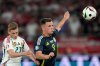 FILE - Hungary's Kevin Csoboth, left, and Scotland's Lawrence Shankland, right, challenge for the ball during a Group A match between Scotland and Hungary at the Euro 2024 soccer tournament in Stuttgart, Germany, June 23, 2024. (AP Photo/Matthias Schrader, File)