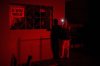 Women use a cell phone flashlight as they chat through a window during a scheduled power outage as part of energy rationing in Santa Cruz del Norte, home to one of Cuba’s largest thermoelectric plants, late Tuesday, Feb. 3, 2026. (AP Photo/Ramon Espinosa)