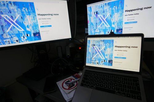 A view of a laptop and monitors showing the X sign-in page in Belgrade, Serbia on Monday, July 24, 2023. THE CANADIAN PRESS/AP-Darko Vojinovic