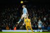 Manchester City's Erling Haaland, top, heads the ball past Brighton's Jan Paul van Hecke during the English Premier League soccer match between Manchester City and Brighton and Hove Albion in Manchester, England, Wednesday, Jan. 7, 2026. (AP Photo/Dave Thompson)