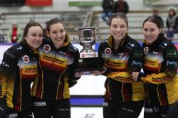 Kelsey Calvert, from left, Beth Peterson, Katherine Remillard and Melissa Gordon-Kurz hoist Manitoba&rsquo;s women&rsquo;s curling championship trophy in Rivers on Sunday. (Thomas Friesen/The Brandon Sun)