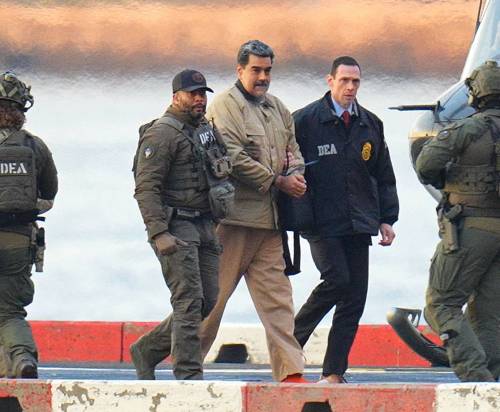Starmax / Newscom via ZUMA Press / TNS
                                Venezuelan President Nicolas Maduro is escorted by federal agents en route to a federal courthouse in Manhattan after landing at a Manhattan helipad on Monday.