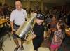 Colin Corneau / BRANDON SUN FILES
                                Brandon native Darren Granger, along with his son Chase, carries the Stanley Cup into the Wheat Kings Hockey School barbeque back in 2014. The Los Angeles Kings equipment manager had the Cup for the day and let the locals have a look.