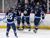 Fred Greenslade / THE CANADIAN PRESS
                                Winnipeg Jets&rsquo; Kyle Connor celebrates his goal against the New York Islanders with Alex Iafallo (9), Dylan DeMelo (2) and Mark Scheifele (55) in the first period.