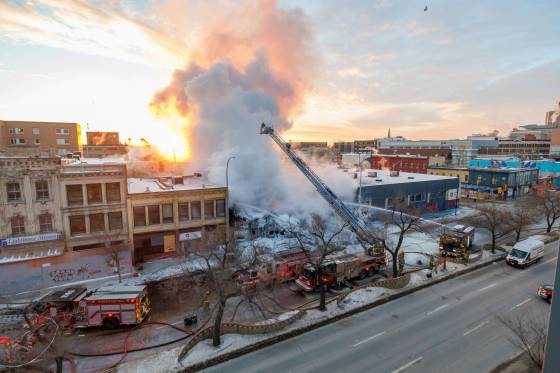 Firefighters battle the blaze at the vacant Manwin Hotel on Wednesday morning. (Mike Deal / Free Press)